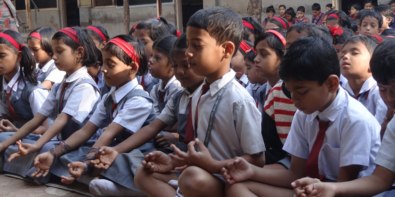 Kids doing meditation with Santosh Joshi